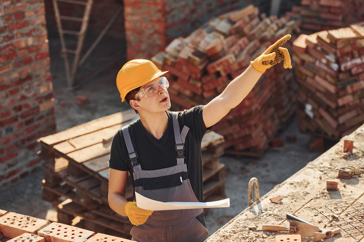 holding-plan-hands-construction-worker-uniform-safety-equipment-have-job-building (1)
